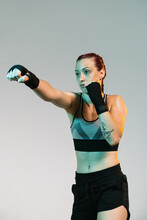 Strong Woman In Sportswear Standing In Fighting Stance