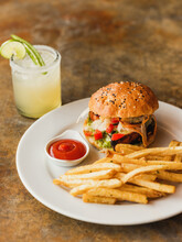 Beef Burger With Fries And A Margarita