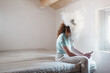 © Ibai Acevedo/Stocksy - White cloud covering woman's head