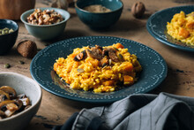 Pumpkin Risotto Topped With Sauteed Mushrooms