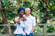 © ByLorena/Stocksy - Happy diverse couple standing in embrace on terrace