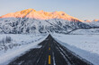 © Heng Yu/Stocksy - Snow mountain with road