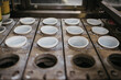 © Melissa Milis Photography/Stocksy - Filling yogurt in a dairy factory