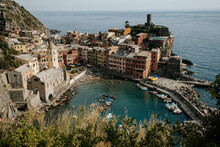 Colourful Buildings And Boats In A Harbour In Vernazza