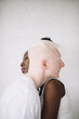 © Jovana Rikalo/Stocksy - Portrait of a young black woman and male albino