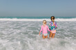 © Tanya Yatsenko/Stocksy - Two girls having fun in the water