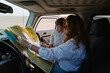© Tanya Yatsenko/Stocksy - Mother and her son with a map in a car