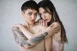 © Jovana Rikalo/Stocksy - Portrait of a young tattooed woman and woman with vitiligo