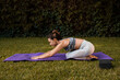 © Soledad Kubat/Stocksy - Fit woman stretching, doing yoga at home