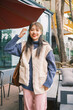 © Pansfun Images/Stocksy - Portrait of young fashionable Asian woman on street