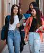 © Bangkok Click Studio - Group of young attractive asian girls college students walking together in university campus smiling and laughing with joy. Concept for education and college students life