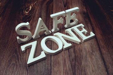 safe zone alphabet letters on wooden background