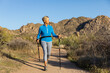 © Raymond Forbes Photography/Stocksy - Senior Citizen Hiking in Arizona Desert