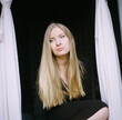 © Anna Malgina/Stocksy - A beautiful blond pensive woman