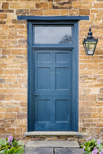 Blue Door In A Sandstone Wall