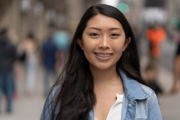 Poster - Young Asian woman in city smile happy face portrait