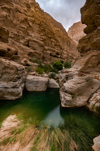 Wadi Shabs In The Sultanate Of Oman. Rocky Gorge Along The Path Way To A Water Spring