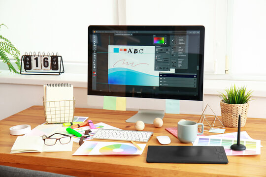 Comfortable workplace of graphic designer in office