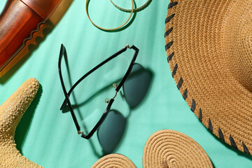 Set of beach accessories on color background, closeup