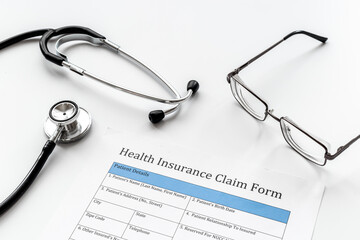 Wall Mural - Health insuranse claim form with stethoscope. Medical care concept.