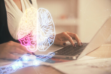 Multi exposure of woman hands working on computer and human brain hologram drawing. Ai tech concept.