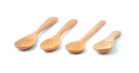 Set of brown wooden spoons on white background.