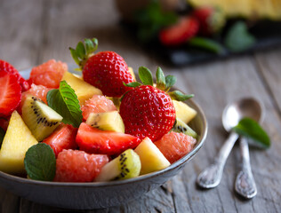 Fruit salad with cut fresh fruit and mint