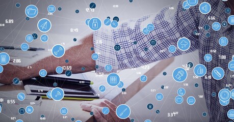 Poster - Network of digital icons against mid section of person using computer at office