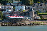 Fototapeta  - Cowes, Isle of Wight, England, UK. 2021. An exterior view of the prestigious Royal Yacht Squadron clubhouse and Castle at West Cowes, Isle of Wight, UK