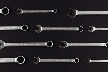 Wall Mural - Wrenches, chrom vanadium spanners on black, dark gray paper background, steel hand work tools