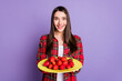 Photo of cute long hairdo young lady give fruit wear red shirt isolated on violet color background