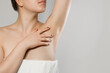 © verona_studio - Armpit epilation, lacer hair removal. Young woman holding her arms up and showing clean underarms, depilati on smooth clear skin .Beauty portrait. Skin care.