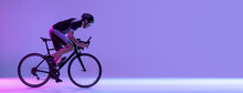 Cyclist Riding A Bicycle Isolated Against Neon Background