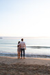 © Milles Studio/Stocksy - Unrecognizable man and woman admiring sea during evening date