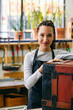 © Inuk Studio/Stocksy - Smiling craftswoman in woodwork studio