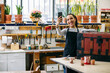 © Inuk Studio/Stocksy - Happy craftswoman taking selfie in woodwork studio