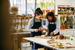 © Inuk Studio/Stocksy - Craftswomen restoring woodwork in workshop
