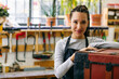 © Inuk Studio/Stocksy - Smiling craftswoman in woodwork studio