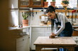 © Inuk Studio/Stocksy - Female carpenter working with plane in workshop