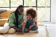 © Malquerida Studio/Stocksy - Girl and her father preparing a banner for feminist protests