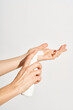 © Martí Sans/Stocksy - Woman applying foamy cosmetic product on hand
