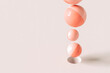 © Giada Canu/Stocksy - Pink spheres in different sizes above a hole