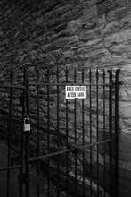 Wrought Iron Gate With "Area Closed" Sign