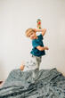 © Olga Moreira/Stocksy - Boy having fun on bed