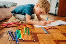 Kid Using Colored Markers To Make Drawings