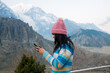 © Tripty Tamang Pakhrin/Stocksy - A young woman using smartphone in the Himalayas