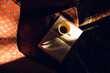 © Léa Jones/Stocksy - cup of coffee with book on an armchair