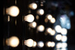 © Marcin Kilarski/Wirestock - Make-up artists mirrors with light bulbs, Fashion Show themed photo.