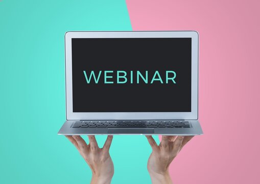 Composition of webinar text on screen of laptop held by hands, on turquoise and pink background
