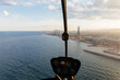 © Marcos Osorio/Stocksy - View of the city of Barcelona from a helicopter at sunset